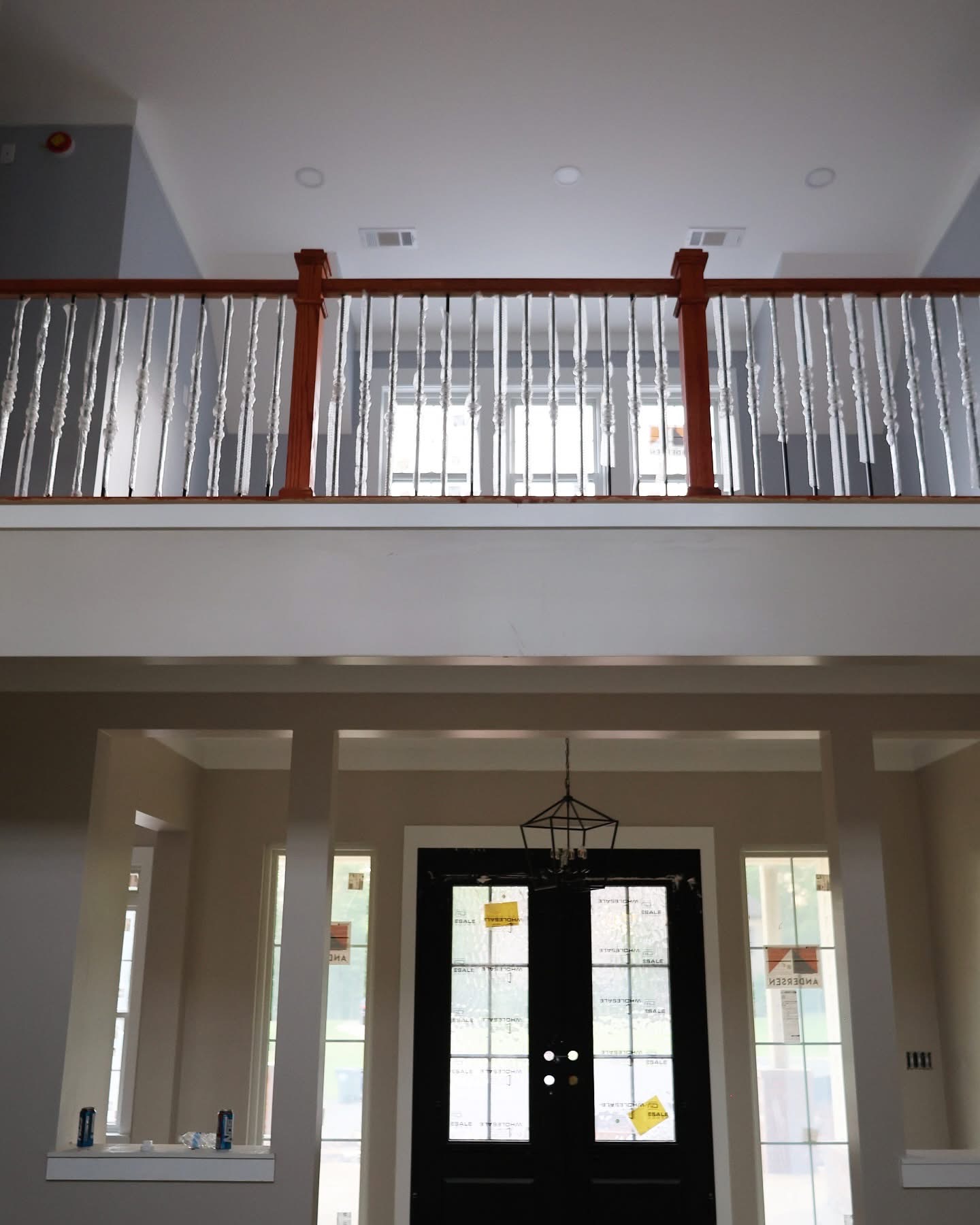 Stair railing and interior trim work installation in progress