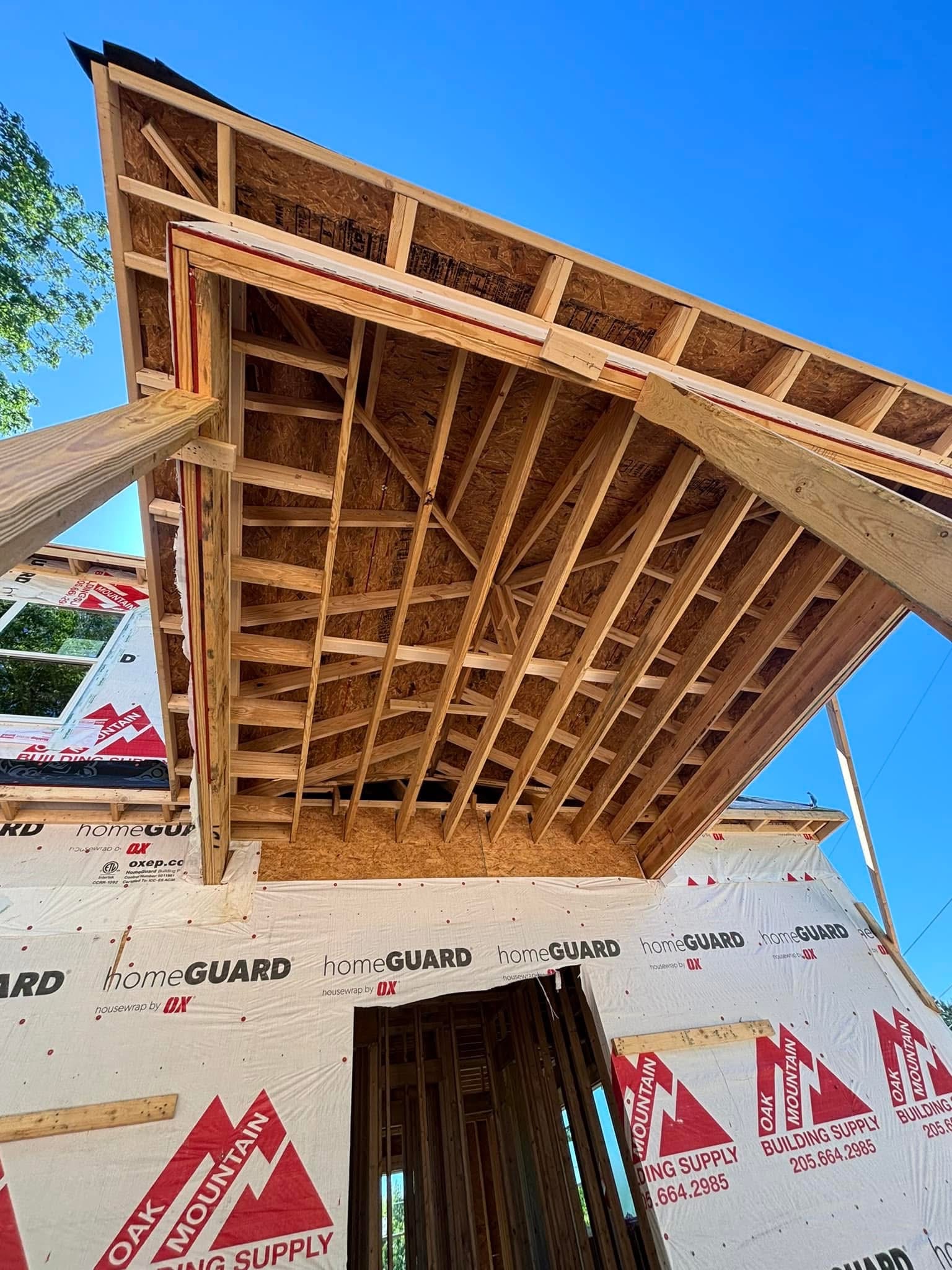 Early framing on the Ridgeview Residence hillside home