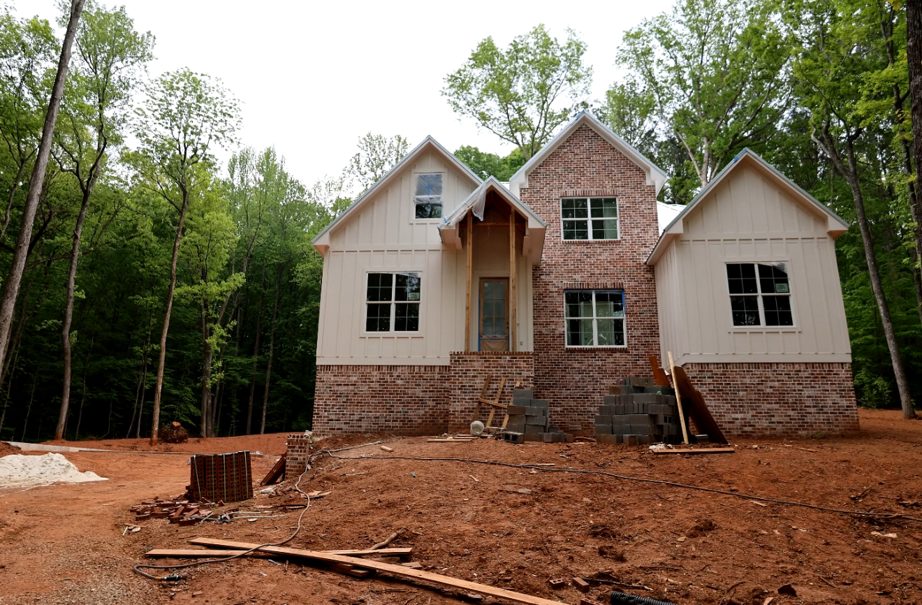 Front elevation with brick base and board-and-batten siding